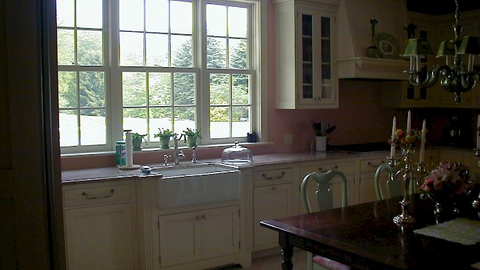 A white Wood-Mode kitchen with a Lancaster recessed flush inset door style.