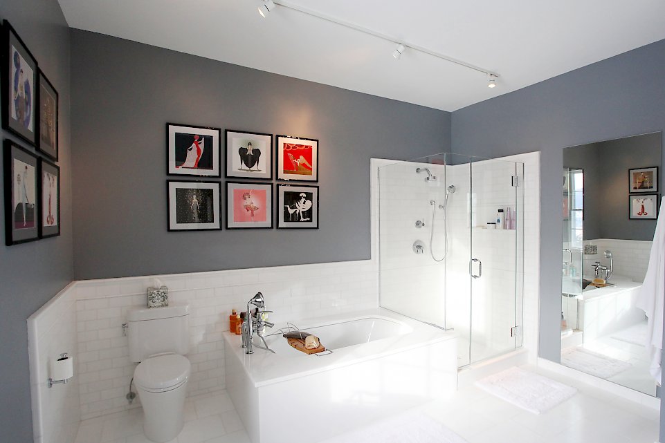 View of the tub and shower wall.